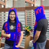 Scarf with cap and pockets