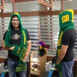 Scarf with cap and pockets